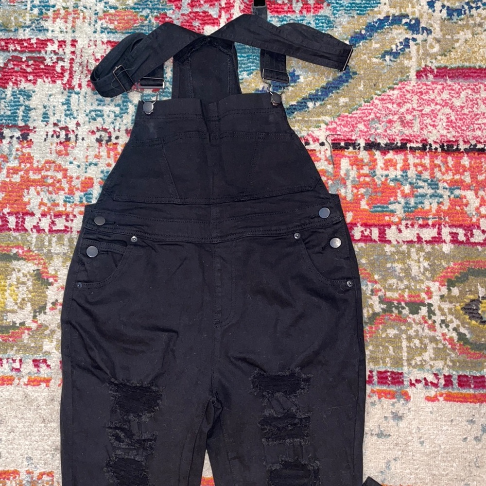 Size Large black distressed skinny overalls